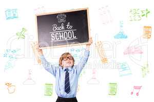 Composite image of cute pupil holding chalkboard