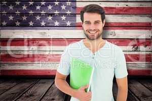 Composite image of student holding notepad