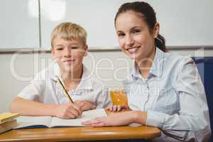 Teacher helping a student in class