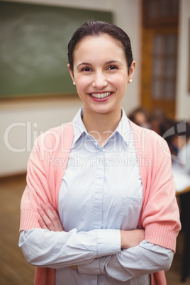 Teacher smiling at camera in classroom