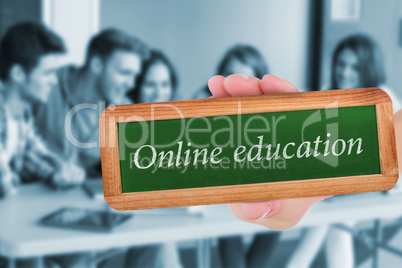 Online education against smiling friends students using laptop