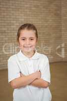 Happy pupil with folded arms