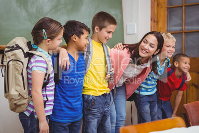 Students standing in front of blackboard