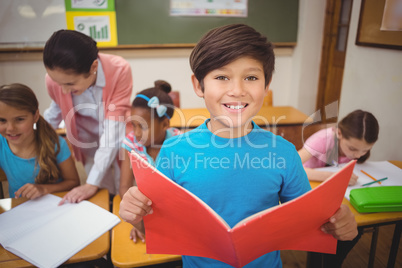 Pupil smiling at camera during class