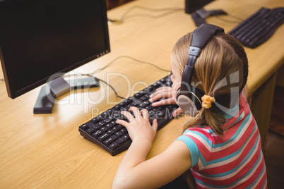 Cute pupil in computer class