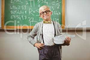 Smiling pupil dressed up as teacher holding books