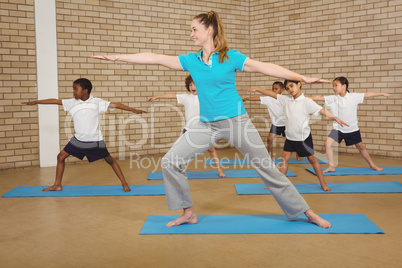 Students and teacher doing yoga pose