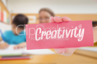Creativity against pretty teacher helping pupil in classroom