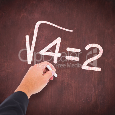 Composite image of hand writing with chalk Composite image of hand writing with chalk