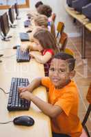 Smiling student using a computer