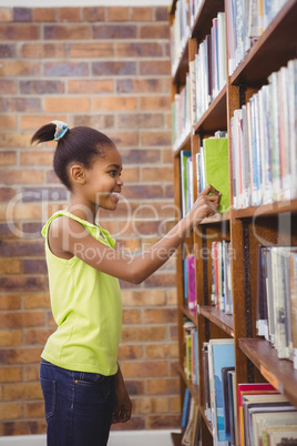 Student choosing a book at a library