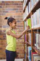 Student choosing a book at a library