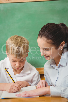 Teacher helping a student in class