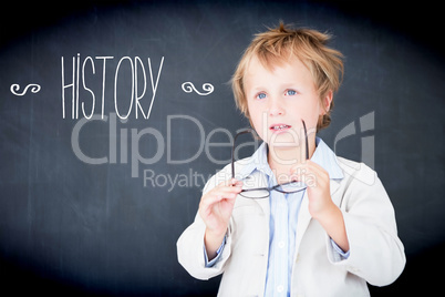 History against boy dressed as teacher in front of black board