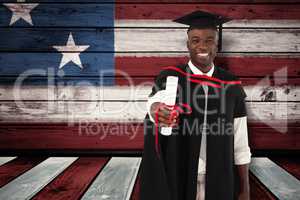 Composite image of man smilling at graduation