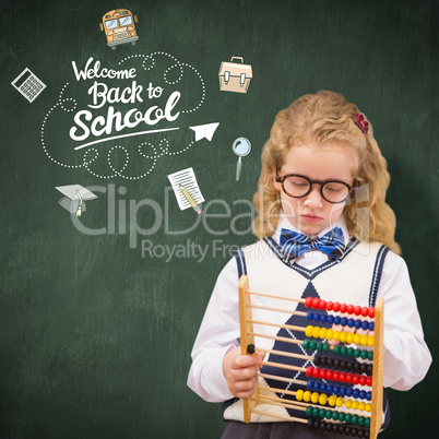 Composite image of pupil holding abacus at elementary school