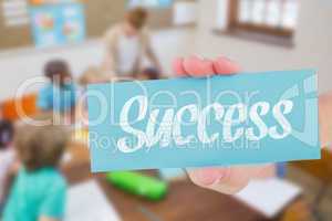 Success against pretty teacher helping pupils in classroom