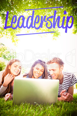 Leadership against happy students using laptop outside