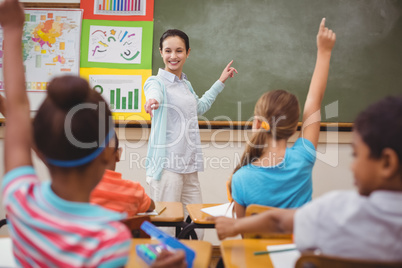 Pupils listening to their teacher at chalkboard