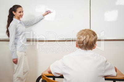 Teacher helping a student in class