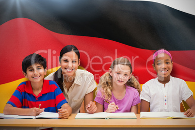 Composite image of pretty teacher helping pupils in library