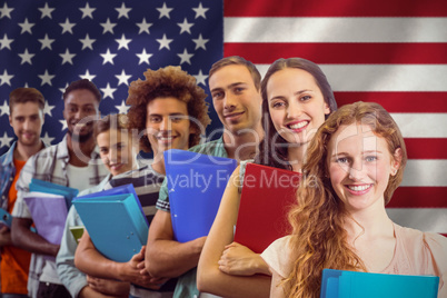 Composite image of fashion students smiling at camera together