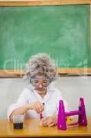 Student dressed up as einstein using a chemistry set