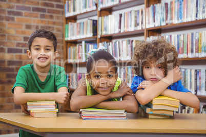 Students leaning upon school books