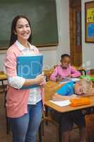 Teacher standing by her students