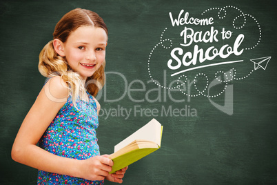 Composite image of girl reading book in library