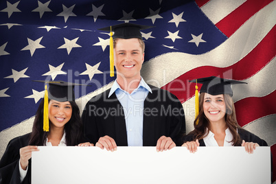 Composite image of three students having graduated holding a bla