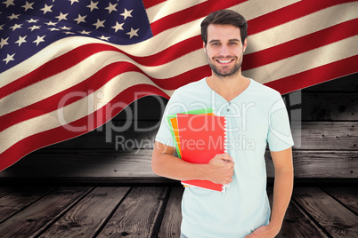 Composite image of student holding notepad