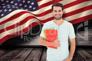 Composite image of student holding notepad