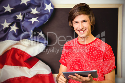 Composite image of smiling student with tablet