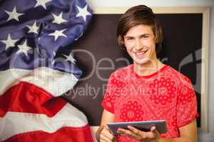 Composite image of smiling student with tablet