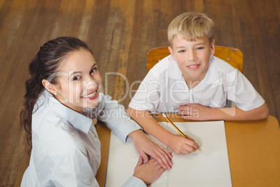 Teacher helping a student in class