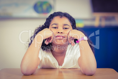 Bored pupil sitting in a classroom