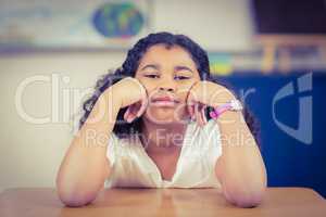 Bored pupil sitting in a classroom