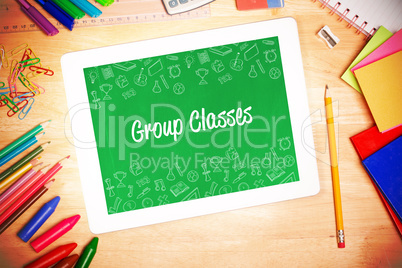 Group classes against students desk with tablet pc