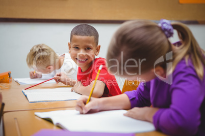 Students smiling and looking at the camera