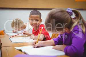 Students smiling and looking at the camera