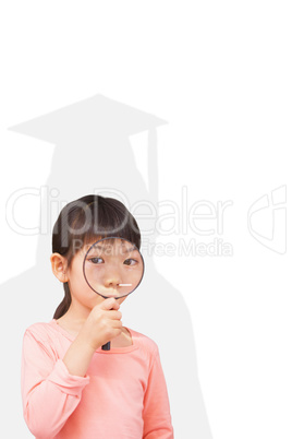 Composite image of pupil looking through magnifying glass