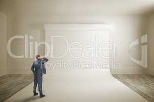 Composite image of thinking businessman