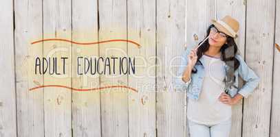 Adult education against pretty brunette thinking and smiling