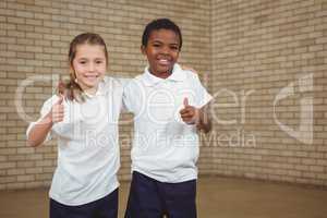 Smiling students with thumbs up