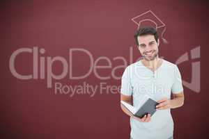 Composite image of student holding book