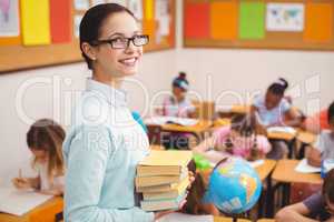 Teacher smiling at camera in classroom