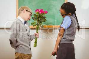 Student giving flowers to another student