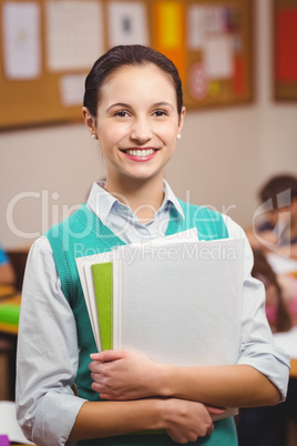 Teacher smiling at camera in classroom