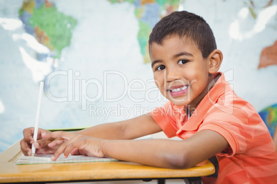 Smiling student doing class work